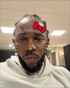 a man with a cat's head painted on his forehead