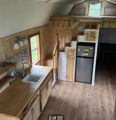 an empty kitchen and living room in a tiny house