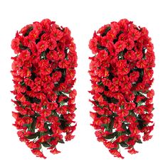 red flowers are arranged in the shape of an oval, with green leaves on each side