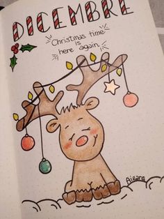 an open christmas card with a drawing of a reindeer