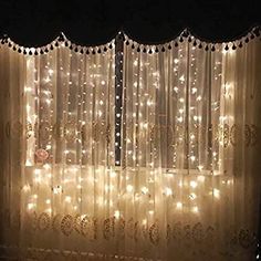 the curtains are covered with lights in the dark