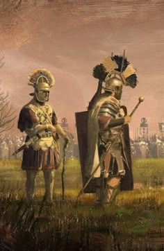 two men dressed in armor standing next to each other on a grass covered field with buildings in the background