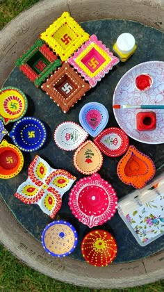 there are many different items on the table together, including plates and cups that have been made out of clay