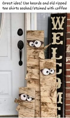 two wooden sticks with eyes on them are sitting in front of a door and the words, great idea use boards and old ripped wood to make these