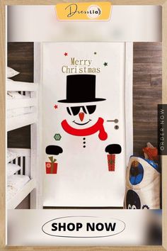 a christmas door cover with a snowman wearing a top hat and glasses on it