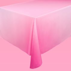 a pink table cloth on top of a white table