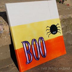 a painted sign that says boo on it