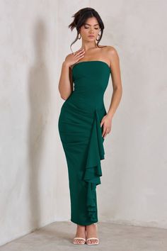 Few bodycon dresses hold a charm quite like Fleur, with a strapless silhouette crafted from sculpting scuba fabric in a bottle green to suit all special occasions. Making this maxi dress all the more endearing is a large ruffle draped elegantly across a split skirt and folded gathers designed to frame your waistline. Pair Fleur with sparkling accessories and you'll really shine at that upcoming event.Features- Premium scuba crepe- Strapless bandeau neckline- Bodycon fit- Gathered waist- Ruffled drape detail- Invisible zip closure- Split hem- Maxi lengthSizing & FitModel is 5'6" and wears UK size 8 / US size 4Product InformationDesigned exclusively by Club L LondonUnlined with some stretchPremium scuba crepe in Bottle Green (95% Polyester, 5% Elastane)140cm lengthSKU: CL129323047 Wedding Features, Midi Bridesmaid Dress, Ruffle Maxi Dress, Black Tie Gala, Scuba Fabric, Strapless Bandeau, Split Skirt, Maxi Dress Prom, Christmas Party Dress