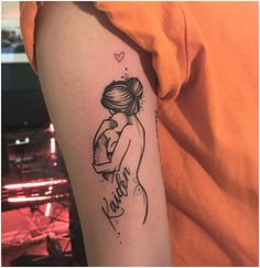 a woman's arm with a tattoo on it that says, love is in the air