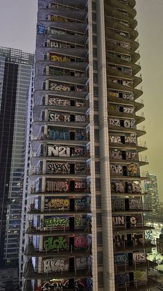 a tall building with graffiti on it's sides