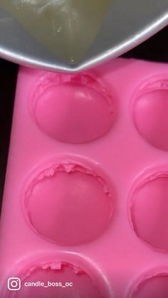 a close up of a pink cake pan