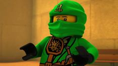 a lego man wearing a green ninja outfit