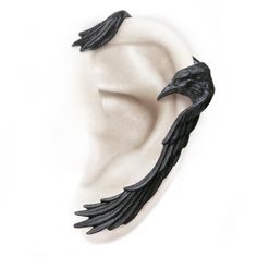 Raven Ear Wrap | Left Ear Cuff | Wrap Around Norse Raven Wing Wrap Note: requires a pierced ear lobe. Material: English Pewter with blackening. One piece (left ear only), 2.2" (5.6cm) x 1.5" (3.9cm). Worldwide shipping available!On back order, please allow up to 1-2 weeks for delivery. Share on social media: Turban Fashion, Fashion Turban, Raven Wings, Black Birds, Wing Jewelry, Accessories Ear, Diy Jewelry Unique, Goth Jewelry, Gothic Steampunk