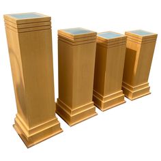 three gold pedestals with blue tops on each side and one in the middle, all facing different directions