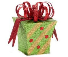 a green gift box with red ribbon and polka dots