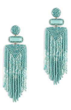 Designed to swish and sway right above the shoulders, these dramatic tassel earrings are handcrafted with shimmery beads and sparkly faux-stone accents. 3 3/4" drop; 1 1/4" width Post back Handmade Brass/glass/enamel/faux leather Imported Turquoise Tassel Earrings With Round Beads, Turquoise Tassel Earrings With Beaded Fringe, Turquoise Earrings With Beaded Fringe, Turquoise Beaded Fringe Dangle Tassel Earrings, Turquoise Beaded Fringe Tassel Earrings For Summer, Beaded Dangle Chandelier Earrings, Elegant Turquoise Beaded Earrings With Fringe, Elegant Turquoise Earrings With Fringe, Turquoise Beaded Fringe Chandelier Earrings