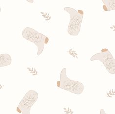 a pattern with boots and leaves on a white background