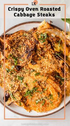 crispy oven roasted cabbage steaks on a white plate with text overlay that reads crispy oven roasted cabbage steaks