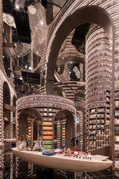 a room filled with lots of books in a library