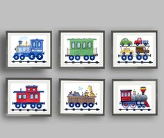 four framed pictures with trains on them, each painted in different colors and sizes to match the wall