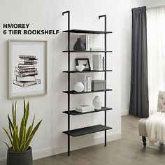 a book shelf in the corner of a room next to a chair and potted plant