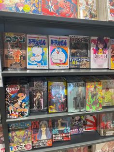 a book shelf filled with comic books on display