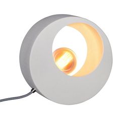 a white circular light with a cord attached to the side and an orange light in the middle