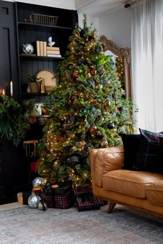 a living room with a christmas tree in the corner