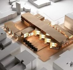 an architectural model of a building with lights on