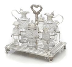 a silver tray topped with lots of glass items