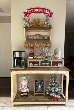 a coffee bar decorated for christmas with gingerbread cookies and hot cocoa bars on top