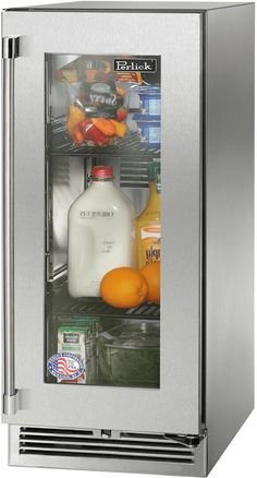 a stainless steel refrigerator with milk and oranges