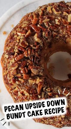 a pecan upside down bundt cake recipe on a white plate with the words pecan upside down