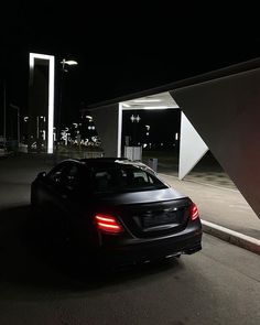 a car is parked in the parking lot at night