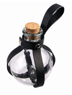 an empty glass bottle with a cork top and black strap around the neck, on a white background