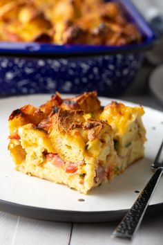 a close up of a plate of food with a casserole in the background