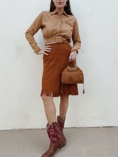 1950s/50s Western Suede Side Zip Skirt- S/M Awesome and rare, 1950s western suede fringe cowgirl skirt. High waisted fit. Diamond belt loops. Metal Prentice zipper. Some light wear. Overall great condition.  Waist: 27" Hip: 39.5" L: 23.5" For more true vintage we're on Instagram @venusthreadsco For expedited or priority shipping please dm us! We offer free ground shipping:) Western Mid-calf Suede Boots With Suede Lining, Fringed Suede Skirt, 70s Suede Skirt, Cowgirl Skirt, Suede Fringe, Side Zip, True Vintage, Festival Season, Overalls