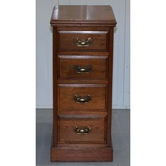 three drawers with brass handles on each drawer