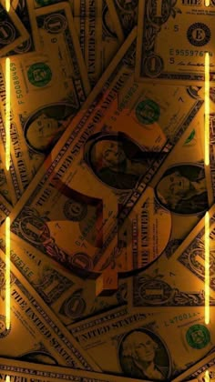 a pile of money with the letter f on it's side and yellow lights