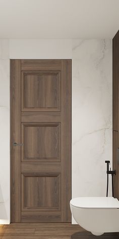 a white bath tub sitting next to a wooden door