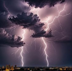 lightning strikes over the city at night