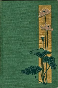 an old book with flowers and leaves on the front cover, in gold trimming