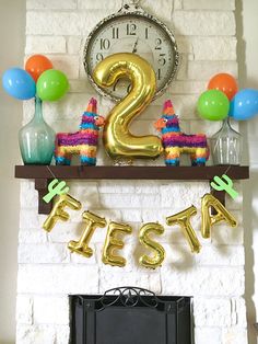 there is a birthday decoration on the mantle