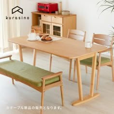 a wooden table with two chairs and a bench