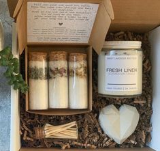 a box filled with different types of candles and other things to make it look like something out of a fairy tale