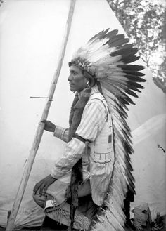 an old black and white photo of a native american man