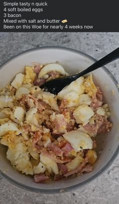 a bowl filled with food sitting on top of a table