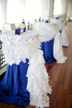 two tables covered in blue and white cloths