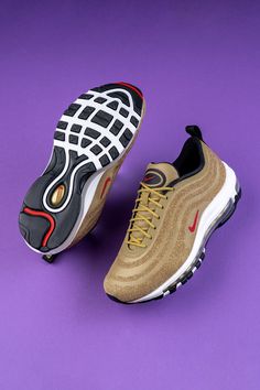 Transitioning over from jewelry to sneakers was a cinch for Swarovski. The Nike Air Max 97 “Metallic Gold” supplied the base, and the luxury jeweler added its elegant proprietary Crystal Fabric along the wavy panels for a unique look in and of itself. Crystal Fabric, Shoe Inspo, Stadium Goods, Jordan 3, Nike Air Max 97, Best Sneakers, Red Accents, Sneaker Head, Metallic Gold