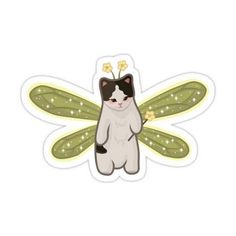 a sticker with a cat sitting on it's back and a dragon wing in the background